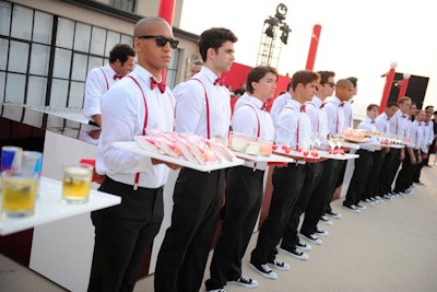 Also incorporated into the color scheme were the outfits the waitstaff wore. SPEC worked with Mary Giuliani Catering to execute the idea, which had male servers in white shirts with red bow ties and suspenders.