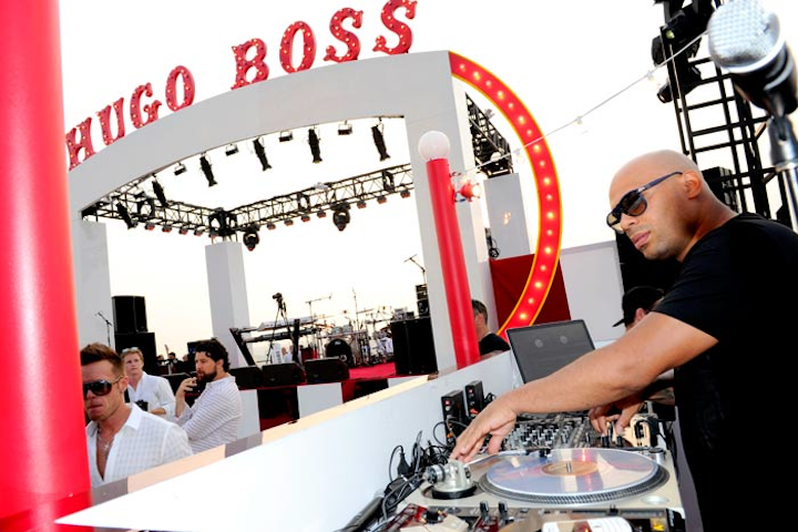 The largest design component was an impressive marquee over the main stage. The curved, red and white piece included the logo of Hugo Boss refashioned in a circus-style font.
