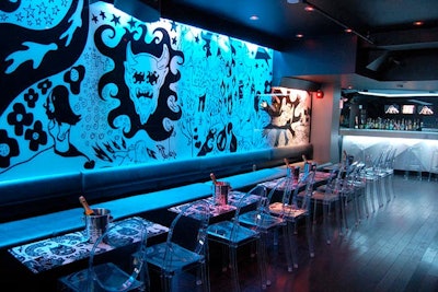 Blue lights illuminate futuristic champagne lounge FOMO.