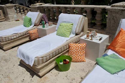 Daybeds dressed in colorful fabric lined the pool's perimeter.