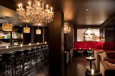 Revamped and reopened in April, the Paramount Bar now offers an interior furnished with red velvet banquettes, crystal chandeliers, and vintage black-and-white photographs.