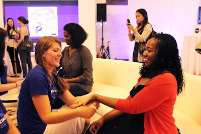 Visitors to the lounge can get hand massages from reps.