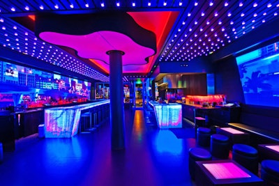 A grid of 1,000 color-changing frosted replicas of ice cubes and LED lighting cast rays over Haven Lounge's dance floor.