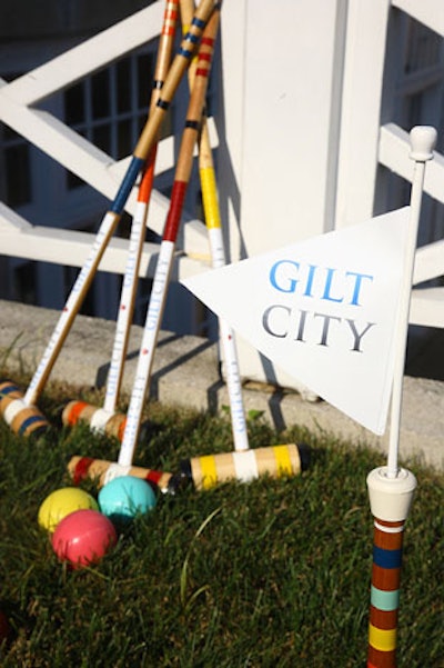 Gilt branded the mallets for its croquet game in the grass.