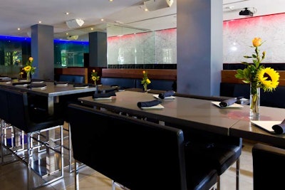 Barcode has high-top tables and seating throughout its bar area.