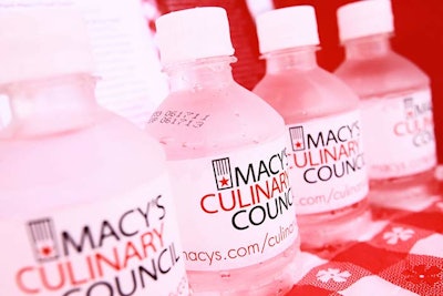 Macy's branded water bottles, napkins, and plates with the Culinary Council's logo for the tour.