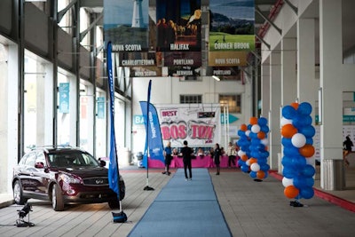 A large 'Best of Boston' sign hung above the check-in table, which was draped in pink linens. A model car from sponsor Infiniti flanked a blue carpet, which nodded to fellow sponsor Jet Blue.