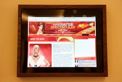 In addition to replacing the photos lining the salon walls, Wanderer placed iPads into the docks on the walls, setting the portable computer tablets to the dedicated site for Hair Battle Spectacular.