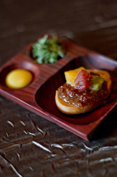 Cuisiniers Catered Cuisine and Events offers a new take on the classic B.L.T.: a rye crostini topped with bacon marmalade and heirloom tomatoes served with micro arugula and house-made mayo.