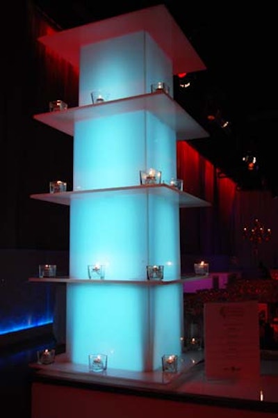 Glowing blue columns with votive candles lit the bar.