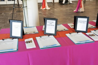 The event's pink and orange color scheme played into the silent auction table's linens.