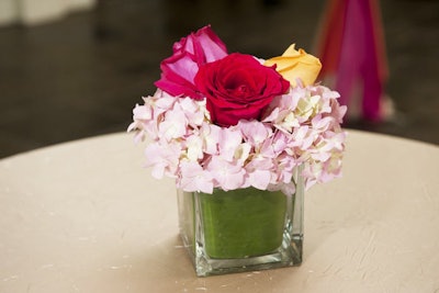 Roses and hydrangea blossoms filled centerpieces at the alfresco reception.