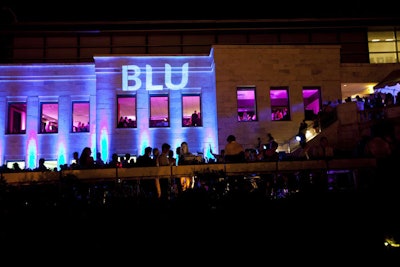 The event's name shone on the side of the building overlooking the terrace.