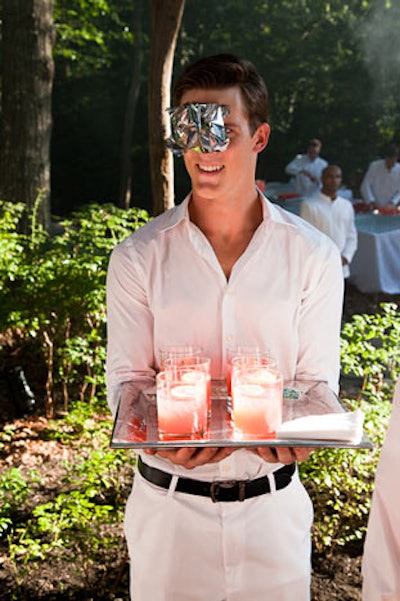 To complement Iranian artist Nazanin Fakoor's 'The Flower' Mylar sculpture, which was suspended at the entrance to the center, waitstaff greeted guests wearing accessories that were hybrids of party masks and natural formations.