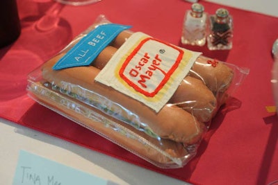 The tongue-in-cheek dinner decor was a play on everyday objects and foods. Many of the pieces were stitched onto the table runners to stabilize them, while others, including the pillow-size pieces, were notďż˝'allowing guests to take them home after the event.