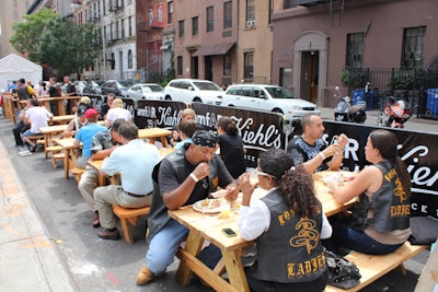 Open to the public, the New York block party offered picnic benches so attendees could sit while eating their food.