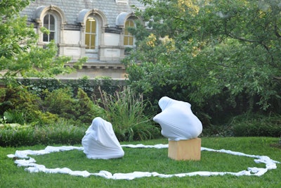 Two dancers from the Glades Dance Collective fully encased in white spandex performed at the beginning of dinner.