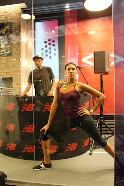 In the north windows of the Flatiron district store is a two-lane Mondo running track, and for the event, the producers placed the DJ booth and models sporting New Balance gear in the glass-enclosed area.