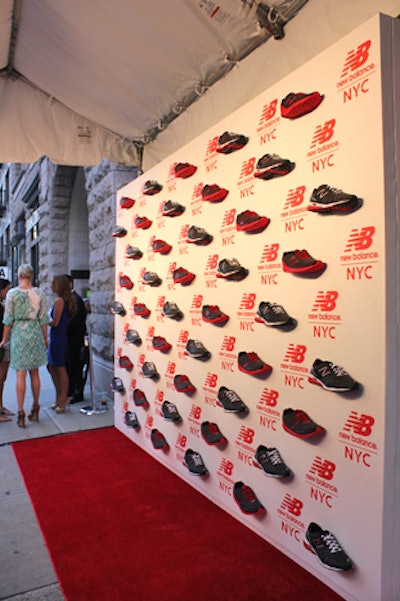 As a fun, three-dimensional take on a run-of-the-mill step-and-repeat, the V.I.P. preview for the store used real running shoes mounted to a wall as a backdrop for the red carpet.