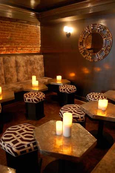 Oyster-cracker-shaped ottomans and cushioned banquettes make up the seating in the Den.