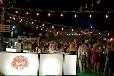 The illuminated bar was in the middle of the lot. Bartenders served Stella and Smartwater.