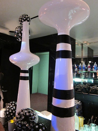 Towering black-and-white decor pieces will top the bars.