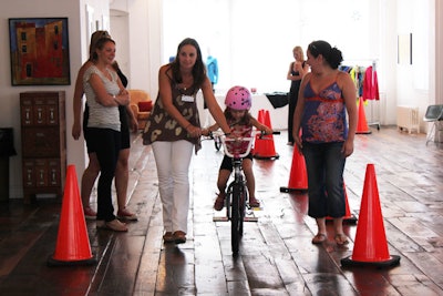 The main purpose of the event was allowing kids to test-drive the bikes, which they could do at an indoor track that was divided in half by traffic cones.