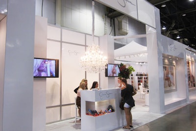 Jessica Simpson's towering white booth included a chandelier for a feminine, upscale look.