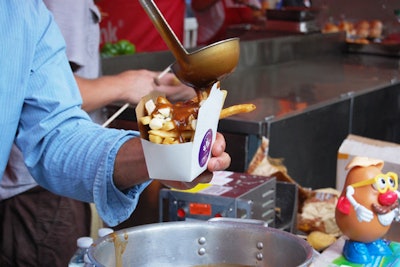 Guests lined up for poutine in the courtyard.