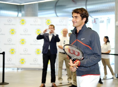 The Swiss Federer made a special appearance at the Mercedes-Benz Manhattan dealership on August 24 to hand out 20 pairs of premium loge tickets to the open.