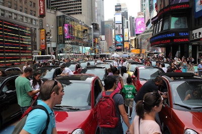 In the pedestrian plaza that runs alongside Times Square's Military Island, Fiat parked three dozen of its 500 and 500 Cabrio model cars for the 'Simply More by Fiat' drive-in promotion this past weekend.