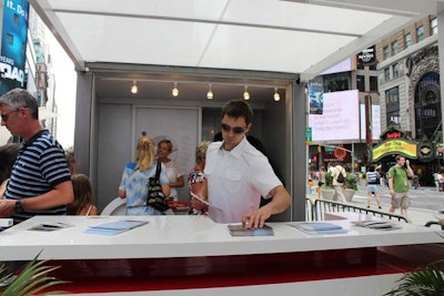 A sleek structure, similar to the type of booths found at auto shows, housed two bars where Fiat distributed free food and drink and information on its vehicles.