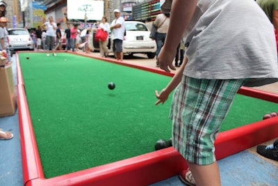 To occupy kids while their parents inspected the cars, a boccie ball court was set up in the plaza.