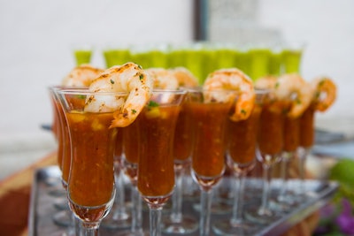At a luncheon, Bill Hansen Catering served shots of cocktail sauce with shrimp.