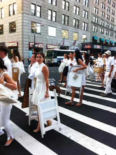 We were all eager to find out where we were headed and which subway we would drag ourselves and our supplies through, something I was not looking forward to doing. We headed west and walked and walked, gathering group after group of dressed partygoers, and getting comments from pedestrians like, 'Where is the mass wedding?'