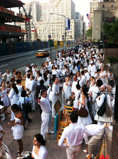 At our check-in point at Broadway and Ann Street, our group leader buzzed around efficiently checking in pairs of New Yorkers, each equipped with the required furniture, bags of food, and supplies, and festively clad in white. Pedestrians continuously stopped and asked what was happening.