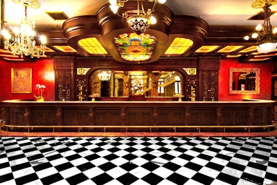 The English Bar room has a 40-foot mahogany bar with illuminated onyx countertops and stained glass soffits.