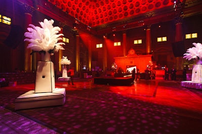 Inside the ballroom, lounge furniture and feather arrangements extended the black-and-white color scheme.