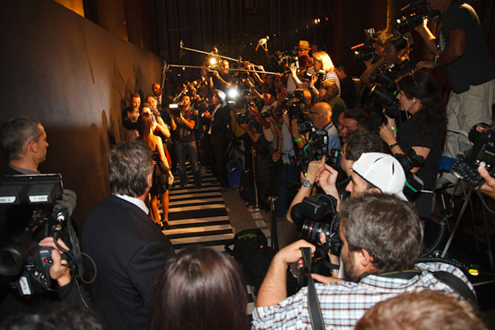 As expected, the Wednesday-night event drew plenty of media attention. However, rather than a red carpet and a step-and-repeat of corporate sponsor logos, the arrivals area was marked by a black-and-white carpet and a plain black backdrop.