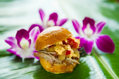 The new Hawaii marketplace will serve pork sliders made in the traditional Hawaiian method known as kalua, meaning they are cooked in an underground oven.