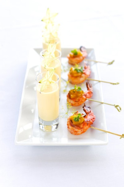 Harissa shrimp with mango dip paired with a shooter of mango lasse from East Meets West Catering in Boston