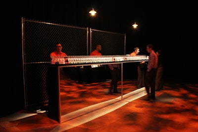 Television network A&E crafted an abstract prison for a reception held March 2 to mark the forthcoming premiere of its new drama series Breakout Kings. The event employed chain-link fencing as the backdrop for bars.