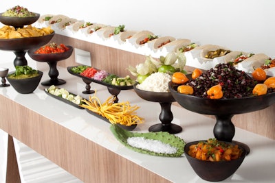Pinch Food Design in New York created a taco station, where guests could decorate homemade tortillas with an array of toppings served in custom-made resin pedestal pieces inspired by handcrafted Mexican pottery.