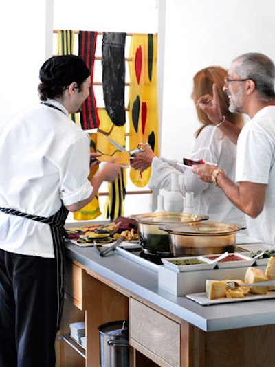Creative Edge Parties in New York offers a cut-your-own pasta station with hanging sheets of handmade pasta in different flavors and bowls of sauces so guests can choose their own custom combinations.
