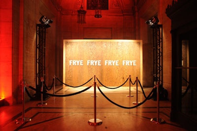 A freestanding, 16-foot-wide and 10-foot-tall wood wall stamped with the brand's name replaced the traditional step-and-repeat for the red carpet arrivals area.