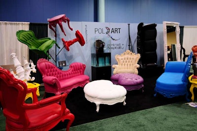 Polart made good use of its 200-square-foot booth by arranging furniture on both the floor and wall.