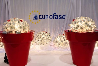 Eurofase used a more minimalist approach to show off its newest artful lighting displays, using large planters to house illuminations.