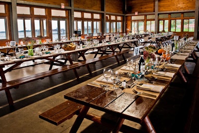 Guests sat at long picnic tables with simple, farm-themed decorations.