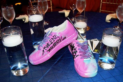 Sneakers decorated with paint and graffiti served as centerpieces on the dinner tables.