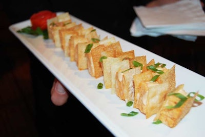 Windows Catering Company served eight passed hors d'oeuvres during the 'pregame' reception, including wild rockfish flan served between two crispy wontons with pink lobster mayonnaise.